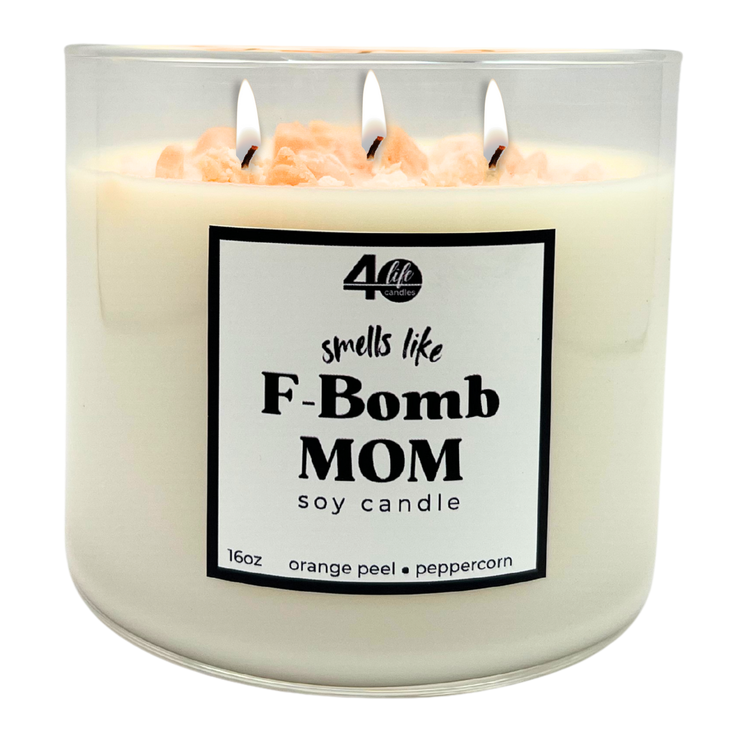 Soy candle labeled 'smells like F-Bomb Mom' with three wicks on a white background