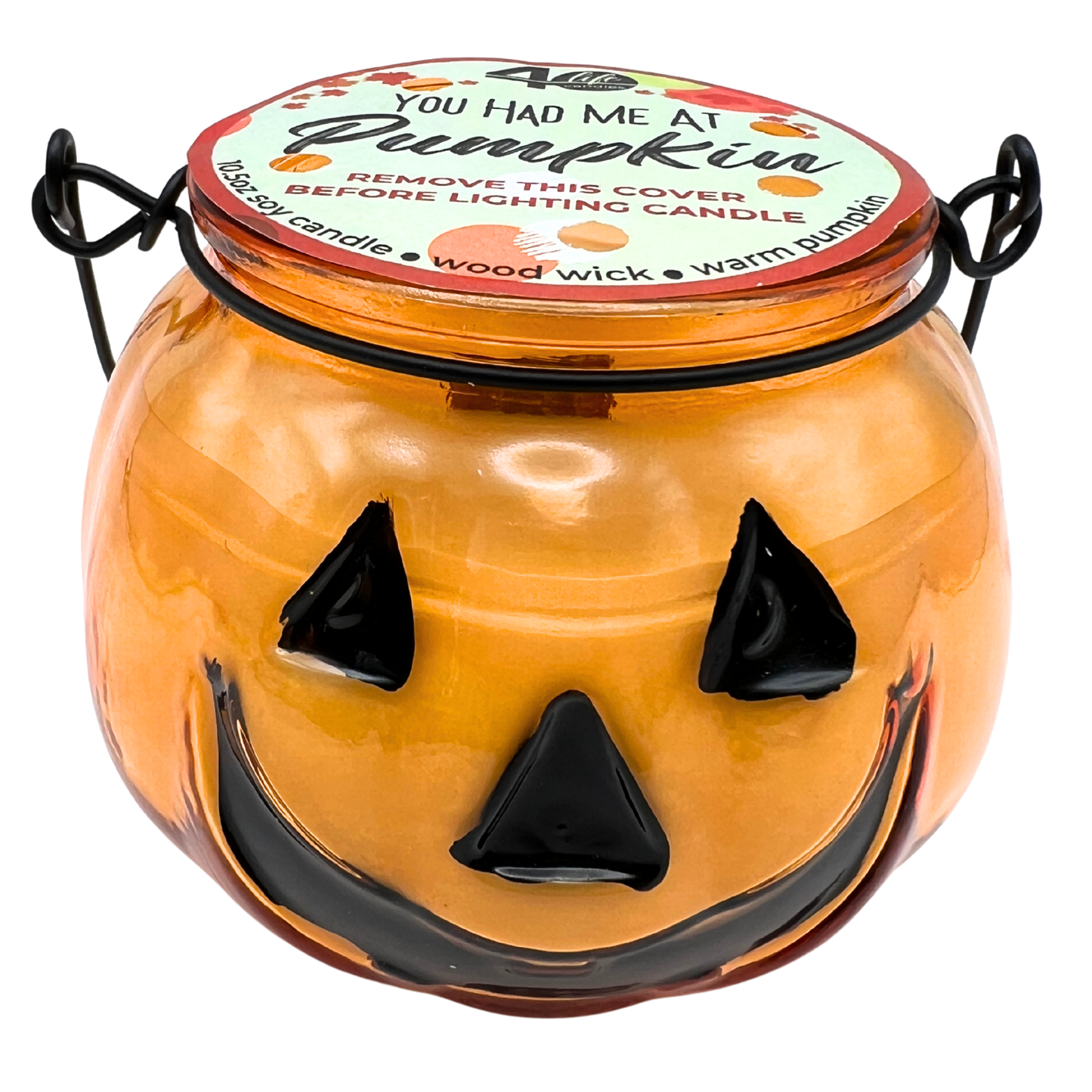 Halloween-themed candle jar with a jack-o'-lantern face on a white background
