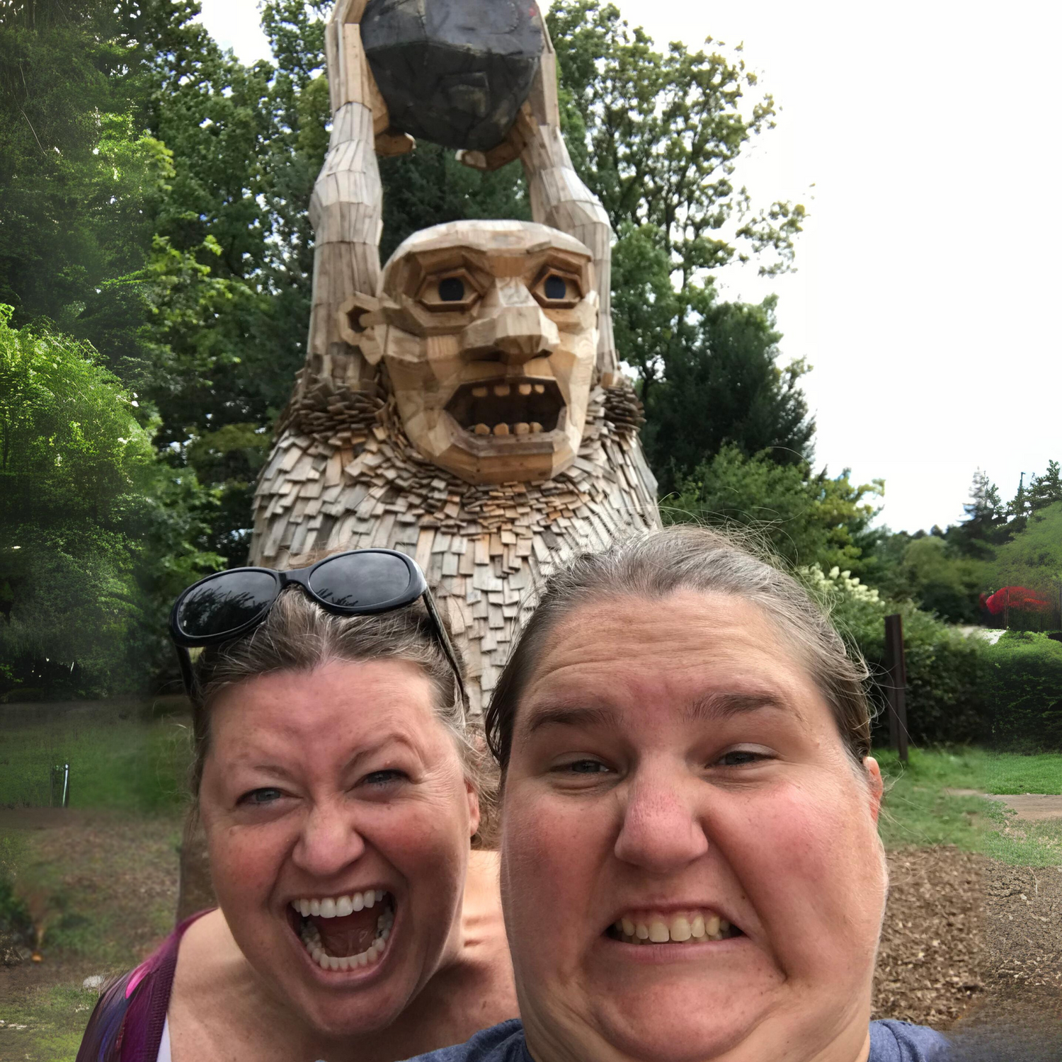 Troll throwing a boulder at people