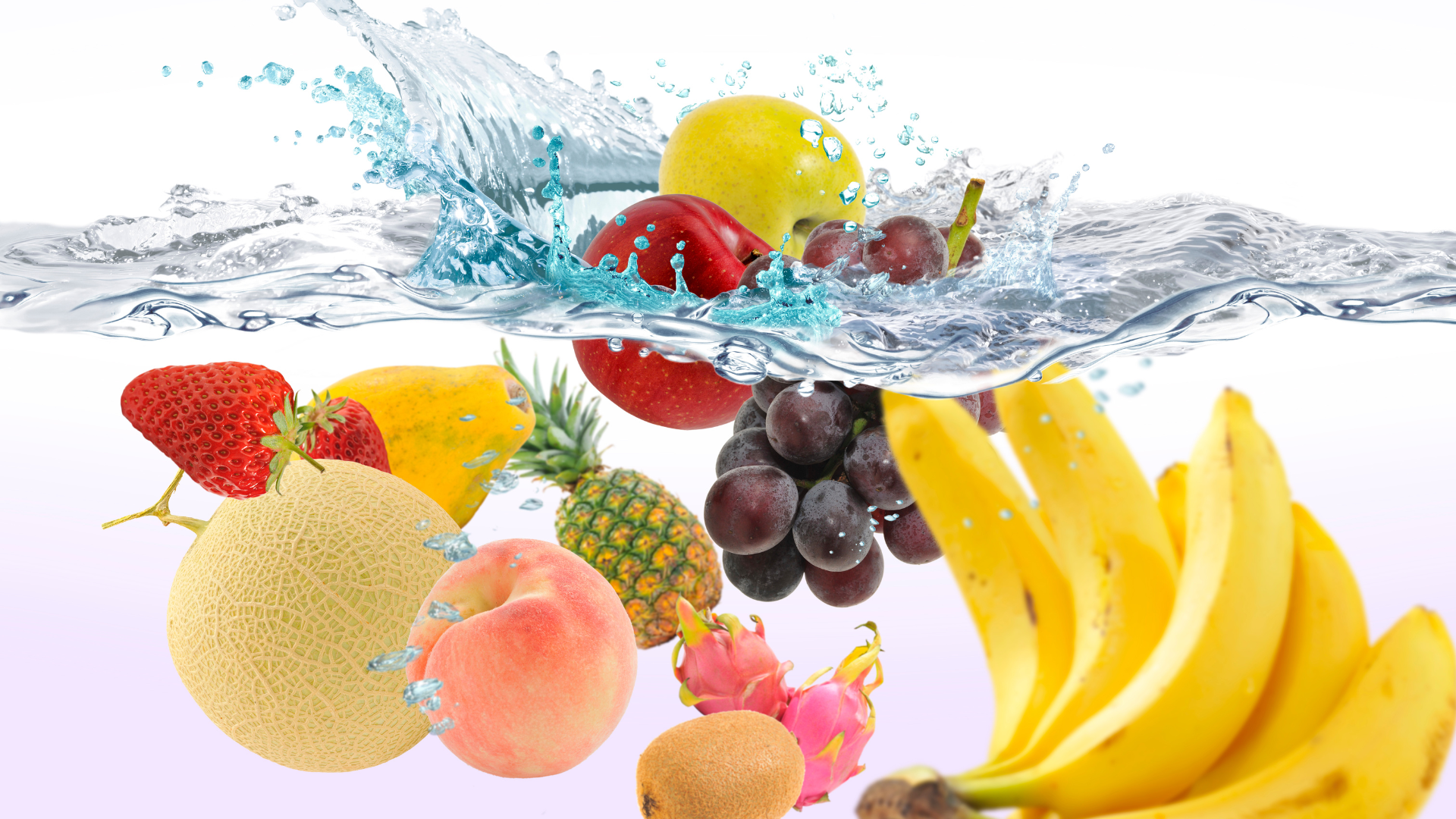 various fruits splashing into water.