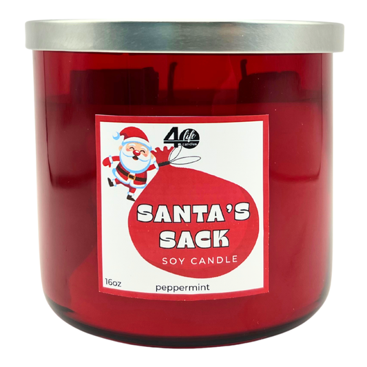 Red candle jar with a Santa Claus label on a white background