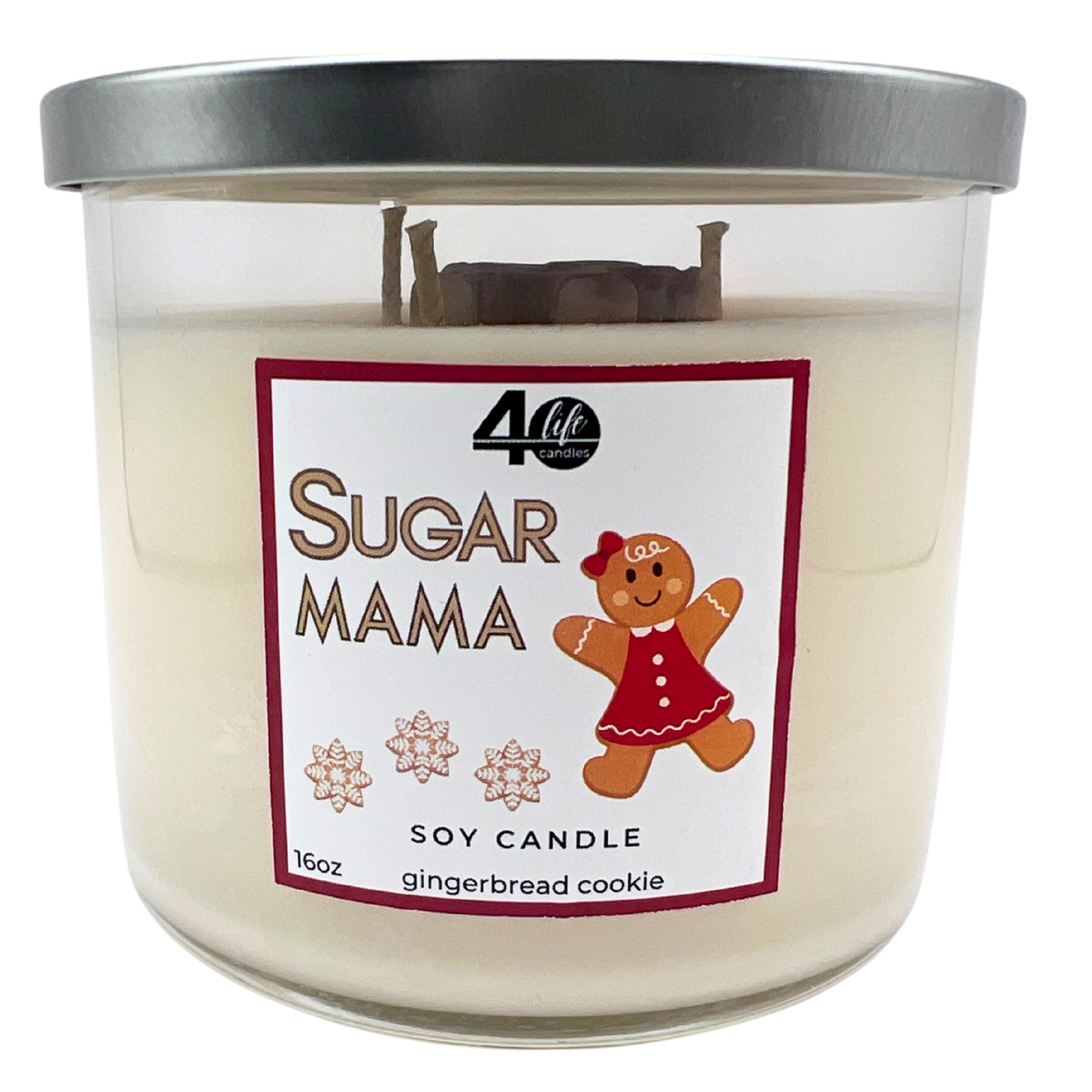 Candle with 'Sugar Mama' label and gingerbread girl illustration on a white background