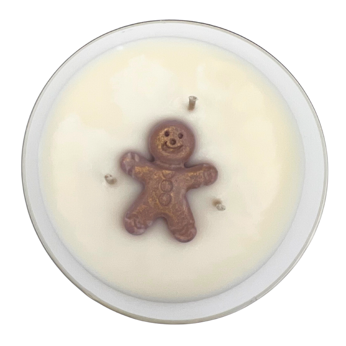 Candle with a gingerbread man soy wax decoration on a white background