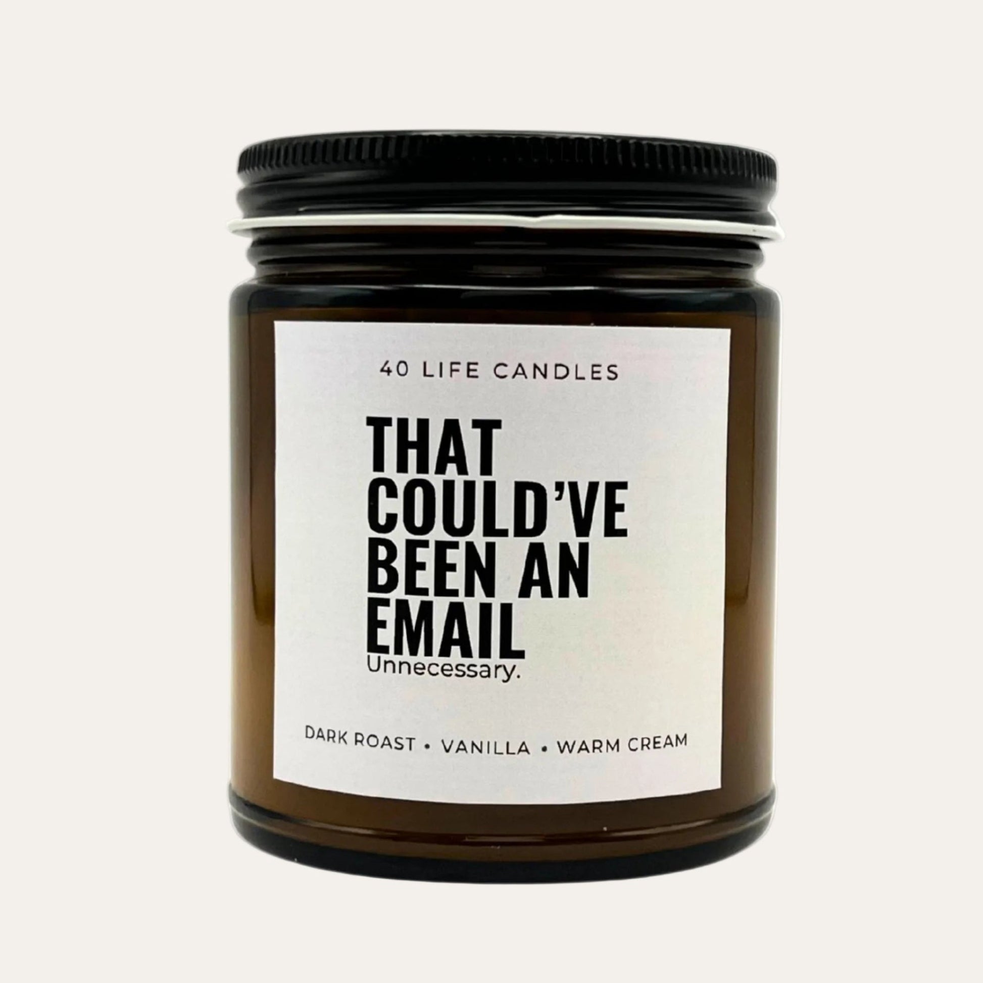 Candle with funny label on a cream background.