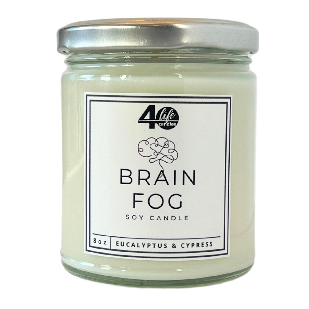 Clean-burning soy candle in a reusable glass jar with a silver metal lid on a white background. Label has a line-drawing simulating a brain.