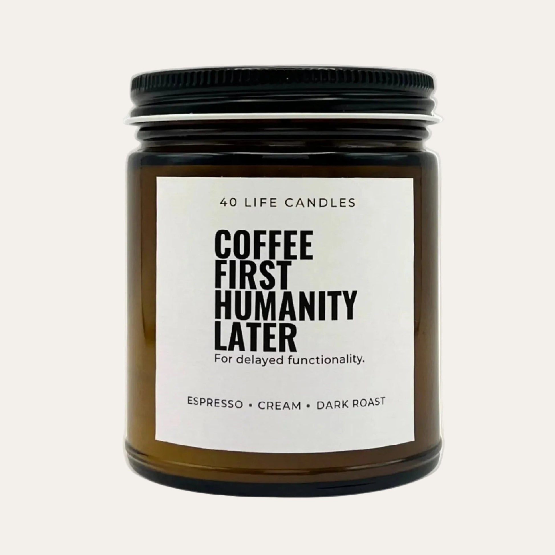Candle jar with a humorous label on a cream background